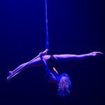 Female circus aerial artist in the splits