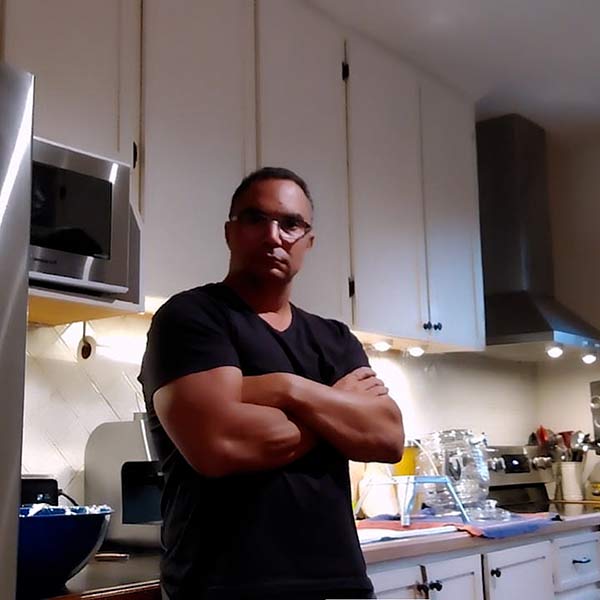 Video frame capture of Jacques Gaines in his kitchen