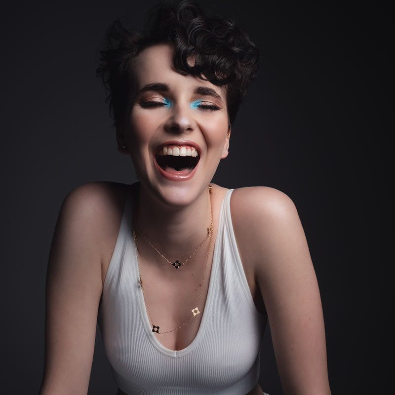 Woman bursting out laughing